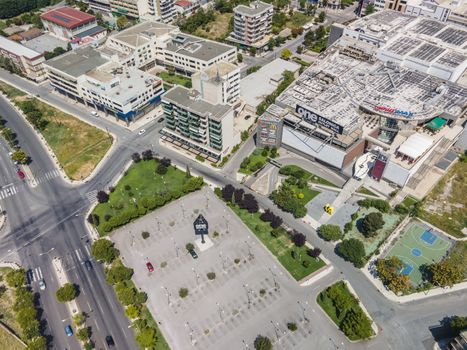 Day top panorama of discount shops area with sign & parking, located at western part of city entrance.