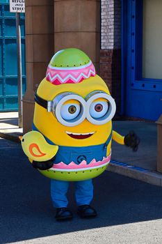 OSAKA, JAPAN - June 17, 2020 : Statue of HAPPY MINION easter version in Universal Studios Japan.Minions are famous character from Despicable Me animation.Universal Studios Japan reopening after COVID-19 quarantine.