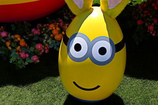 OSAKA, JAPAN - June 17, 2020 : Statue of HAPPY MINION easter version in Universal Studios Japan.Minions are famous character from Despicable Me animation.Universal Studios Japan reopening after COVID-19 quarantine.