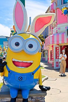 OSAKA, JAPAN - June 17, 2020 : Statue of HAPPY MINION easter version in Universal Studios Japan.Minions are famous character from Despicable Me animation.Universal Studios Japan reopening after COVID-19 quarantine.