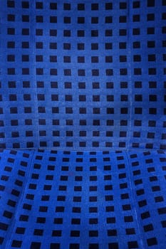  Background blue fabric with black polka dots.