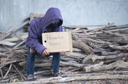 Unhappy homeless man under the bridge