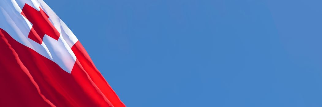 3D rendering of the national flag of Tonga waving in the wind against a blue sky