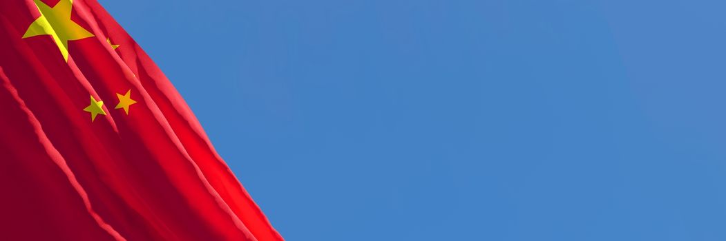 3D rendering of the national flag of China waving in the wind against a blue sky