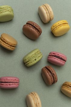 Macaroons on green background from above