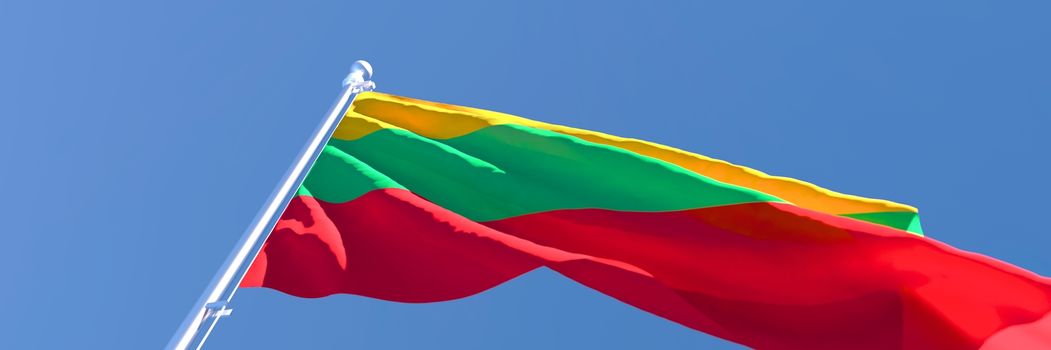 3D rendering of the Lithuania national flag against a blue sky.