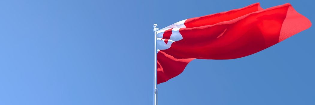 3D rendering of the national flag of Tonga waving in the wind against a blue sky