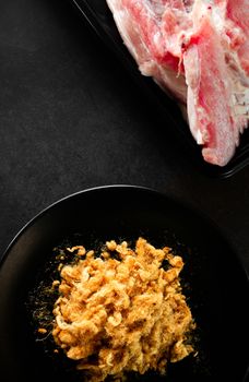 Dried shredded pork on black background, Flossy pork, Raw material, Top view