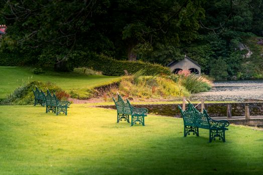 Empty benches on the shore of lake ullswater with beautiful view of the lake's north coast