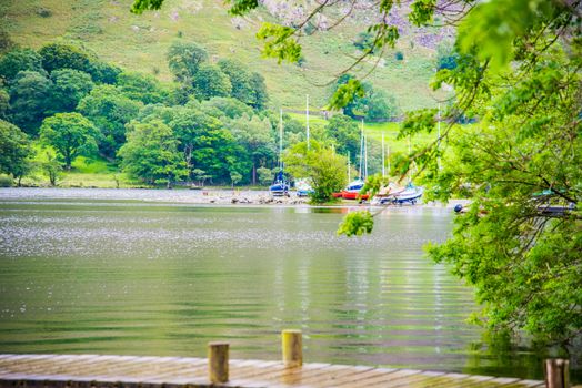 Sailing boats on lake shore, English Lake District