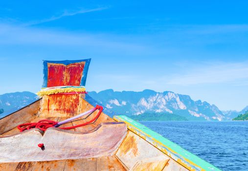 Wooden boat on sailing travel in Ratchaprapa Dam and Cheow Larn Lake, Khao Sok nature beautiful in Thailand