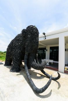 NakhonPathom , Thailand -  6  August, 2020 : Big Mammoth model recycle made from old Car tire in  Caltex petrol station in NakhonPathom KM.14