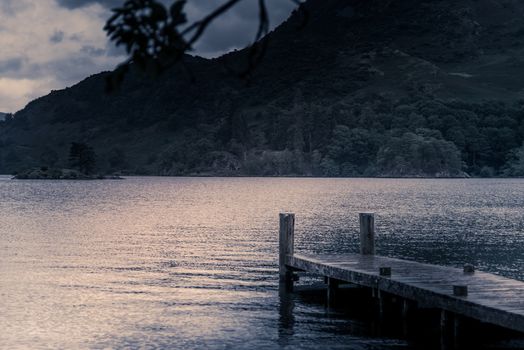 view of stormy skies and jetty north east across ullswater from glenridding