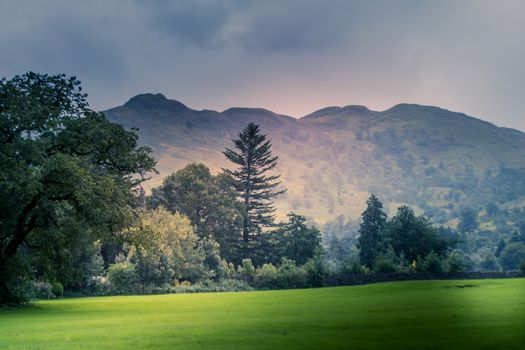 view of stormy skies north east across ullswater from glenridding