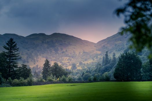 view of stormy skies north east across ullswater from glenridding