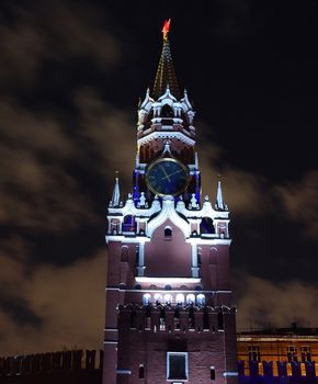 The clock on the Spasskaya tower of the Moscow Kremlin, illuminated during the light show.