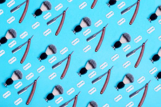 pattern of razors, brush and blade on blue background