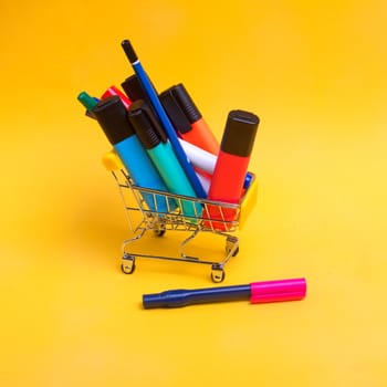 Shopping cart with colorful writing goods