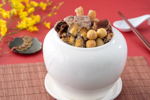 Traditional food of Chinese lunar new year, Buddha jumps over the wall, Chinese Soup Casserole dish, Buddha's Temptation, named Fo Tiao Qiang, close up.