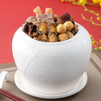 Traditional food of Chinese lunar new year, Buddha jumps over the wall, Chinese Soup Casserole dish, Buddha's Temptation, named Fo Tiao Qiang, close up.