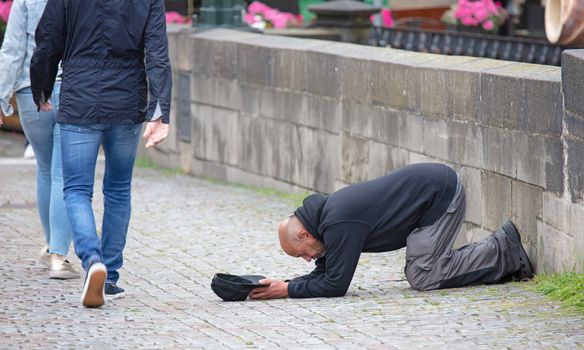 Prague, Czech Republic on july 8, 2020: Beggar begging for alms on the street in Prague
