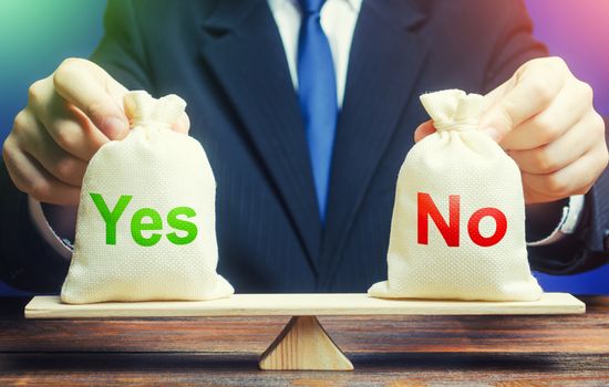 A businessman holds Yes and No bags on scales. Assessing problem and choosing right solution. Advantages and disadvantages. Choose correct answer. Find your way. Ethics and acceptability.