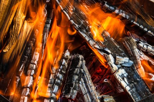 Burning wood chips forming coal. Barbecue preparation, fire before cooking. Hot coal made of greatly heated wood.