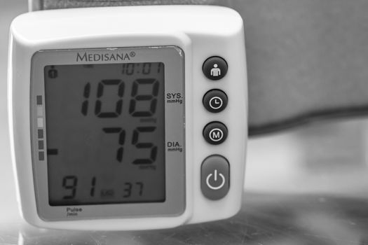 Close up, detail of blood pressure cuff monitor isolated. Digital blood pressure measuring device. Bucharest, Romania, 2020.