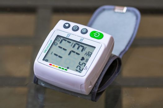 Close up, detail of blood pressure cuff monitor isolated. Digital blood pressure measuring device. Bucharest, Romania, 2020.