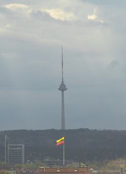 Yellow-green-red Lithuania flag on the background of Vilnius TV tower