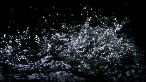 Blurry images of drinking water liquid wave or carbonate drink or oil shape or soda splashing and floating drop in black background for represent sparkling refreshment and refreshing