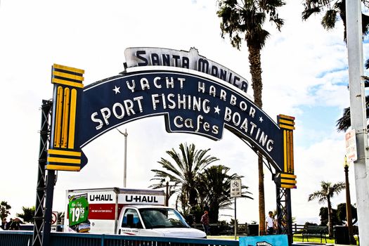 Los Angeles,CA/USA - Oct 29, 2015 : Welcoming arch in Santa Monica, California. The city has 3.5 miles of beach locations.Santa Monica Pier, Picture of the entrance with the famous arch sign.