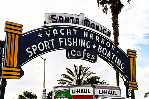 Los Angeles,CA/USA - Oct 29, 2015 : Welcoming arch in Santa Monica, California. The city has 3.5 miles of beach locations.Santa Monica Pier, Picture of the entrance with the famous arch sign.