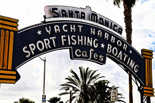 Los Angeles,CA/USA - Oct 29, 2015 : Welcoming arch in Santa Monica, California. The city has 3.5 miles of beach locations.Santa Monica Pier, Picture of the entrance with the famous arch sign.