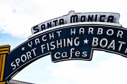 Los Angeles,CA/USA - Oct 29, 2015 : Welcoming arch in Santa Monica, California. The city has 3.5 miles of beach locations.Santa Monica Pier, Picture of the entrance with the famous arch sign.