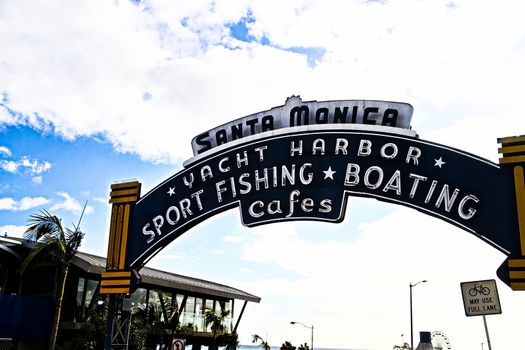 Los Angeles,CA/USA - Oct 29, 2015 : Welcoming arch in Santa Monica, California. The city has 3.5 miles of beach locations.Santa Monica Pier, Picture of the entrance with the famous arch sign.