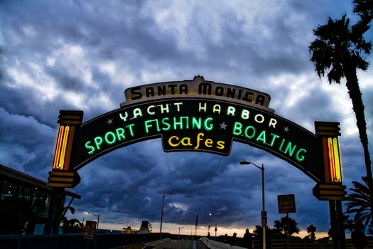 Los Angeles,CA/USA - Oct 29, 2015 : Welcoming arch in Santa Monica, California. The city has 3.5 miles of beach locations.Santa Monica Pier, Picture of the entrance with the famous arch sign.