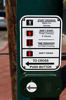 Push button for crossing in crossroad / junction with road blurred background in Los Angeles/USA.