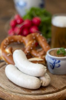 three bavarian white sausages with mustard