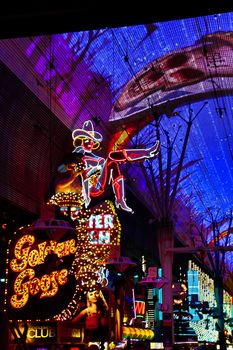 Las Vegas,NV/USA - Sep 12,2018 : Cowgirl neon sign in downtown Las Vegas. The iconic sign of Glitter Gulch is placed in 20 East Fremont Street, in Downtown Las Vegas