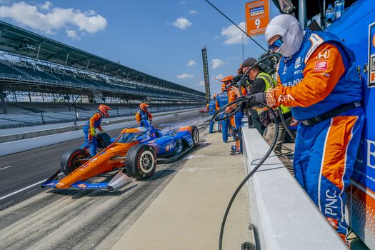 SCOTT DIXON (9) of Auckland, New Zealand brings his car in for service during the Indianapolis 500 at Indianapolis Motor Speedway in Indianapolis Indiana.