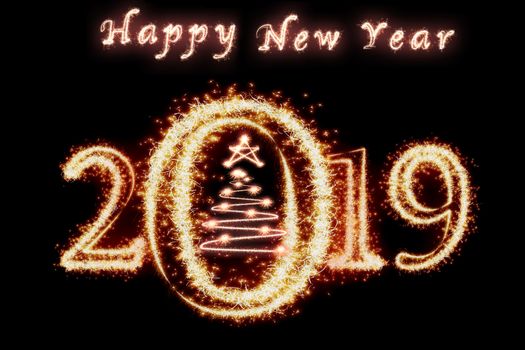 Happy new year 2019 and christmas tree written with Sparkle firework on dark background, celebration and greeting cards concept