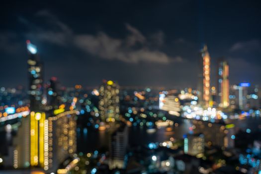 Abstract Photo blurred bokeh of bangkok cityscape river view at twilight time, background concept