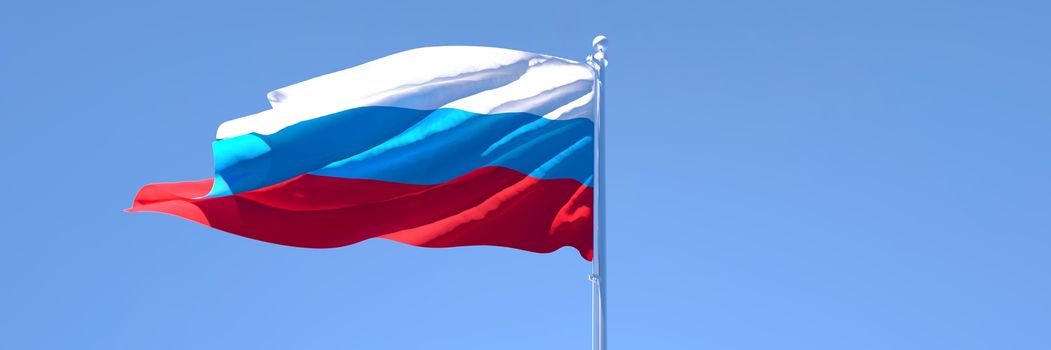 3D rendering of the national flag of Russia waving in the wind against a blue sky