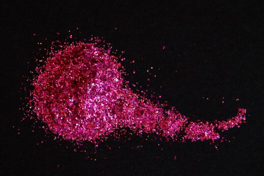 scattering of dark pink shiny glitter on a black background, copy space,