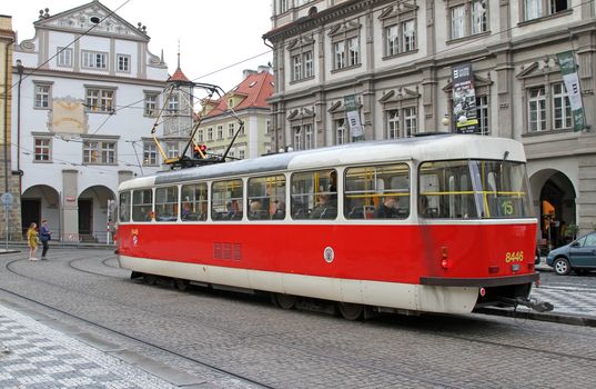 Prague, Czech Republic on july 8, 2020: Red retro tram on the street of Prague.
