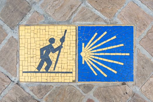 Camino de Santiago pilgrimage sign on the pavement in Chartres, France.