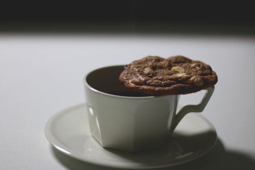 Cookie and cup of coffee on table