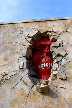 Osaka, Japan - Feb 6 2015 : Life size scale Statue of Wall giant from Attack on Titan (Shingeki no Kyojin) at Universal Studios Japan.