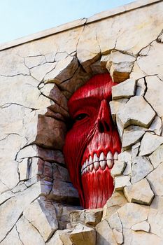 Osaka, Japan - Feb 6 2015 : Life size scale Statue of Wall giant from Attack on Titan (Shingeki no Kyojin) at Universal Studios Japan.